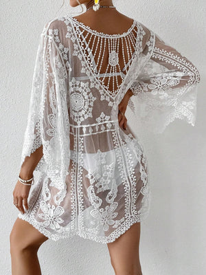 White embroidered crochet kaftan cover-up with bell sleeves and open back detail.