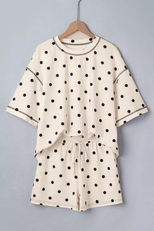 Cream polka dot polyester two-piece set with drawstring shorts and crew neck top.