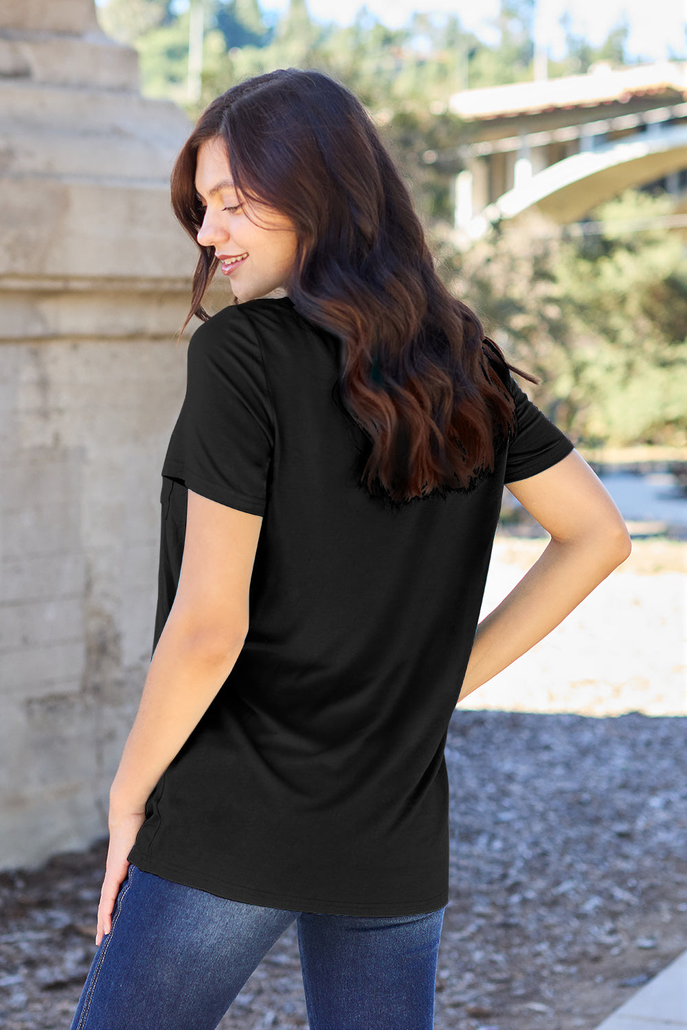 Black V-neck pocket tee with short sleeves and a relaxed fit.