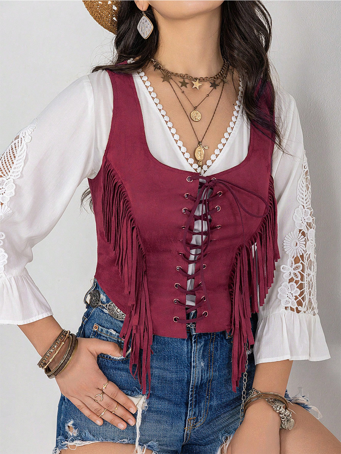 Cerise suede fringe corset vest with lace-up front detail