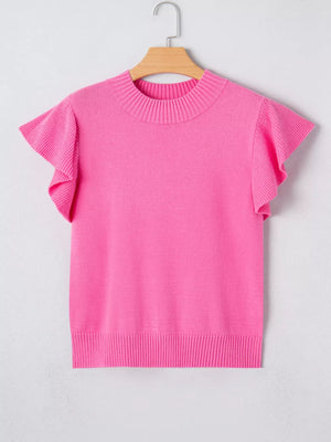 Pink knit top with ruffled short sleeves and ribbed mock neckline.