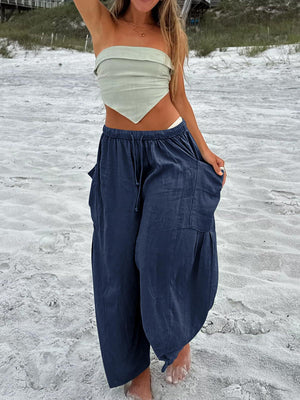 Navy linen balloon trousers with cargo pockets and drawstring waist