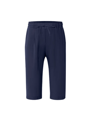 Navy relaxed fit drawstring cropped sweatpants with a casual, loose cut.