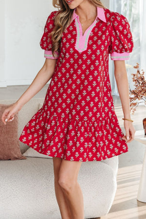 Red floral mini dress with puff sleeves, ruffled hem, and contrast collar.