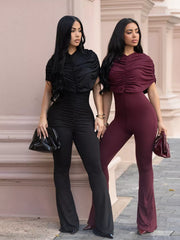 Black and burgundy ruched bodysuits with cap sleeves and flared legs.