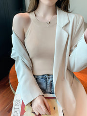 Apricot ribbed knit cami tank top with a crew neckline, styled with a blazer.