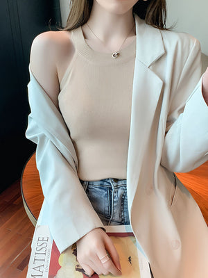 Apricot ribbed knit cami tank top with a crew neckline, styled with a blazer.