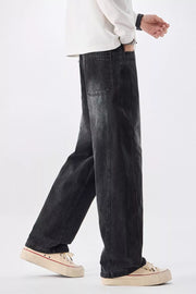 Men's black vintage wash wide-leg denim jeans with a relaxed fit.