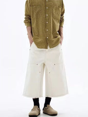Men's white cotton wide-leg cropped cargo pants with raw hem