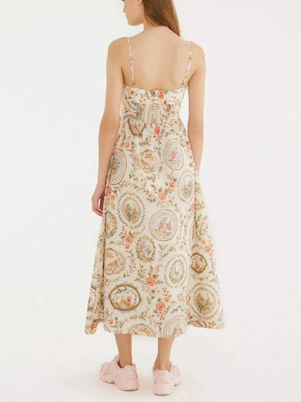 Vintage floral midi dress with spaghetti straps and a-line cut in apricot.