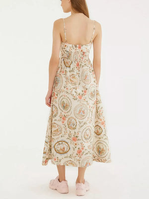 Vintage floral midi dress with spaghetti straps and a-line cut in apricot.