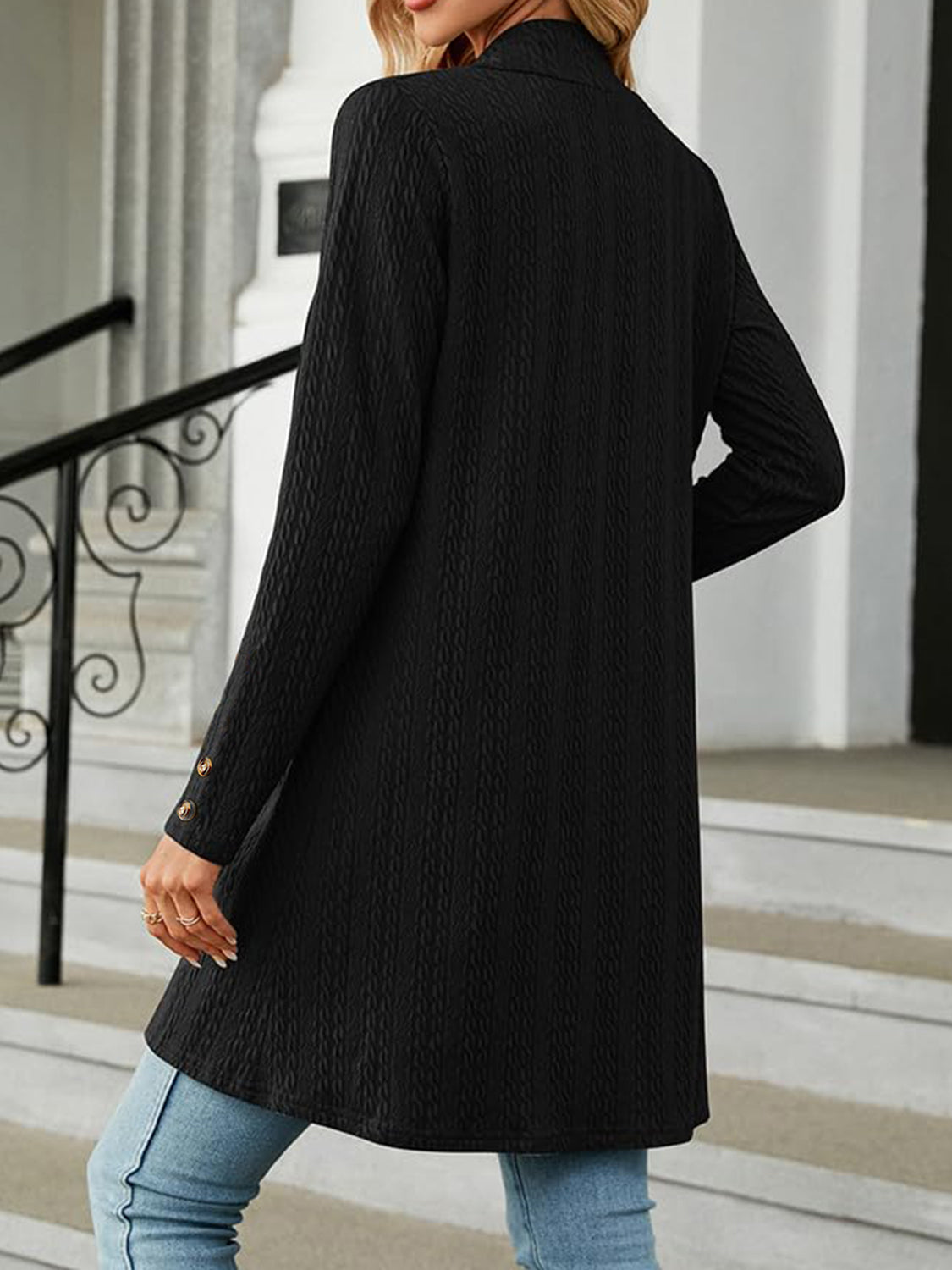 Black textured knit longline cardigan with button detail on sleeve