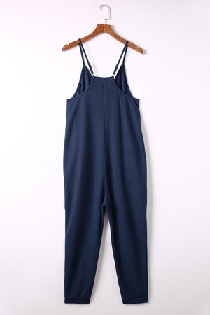Navy jersey jumpsuit with spaghetti straps and relaxed fit pants