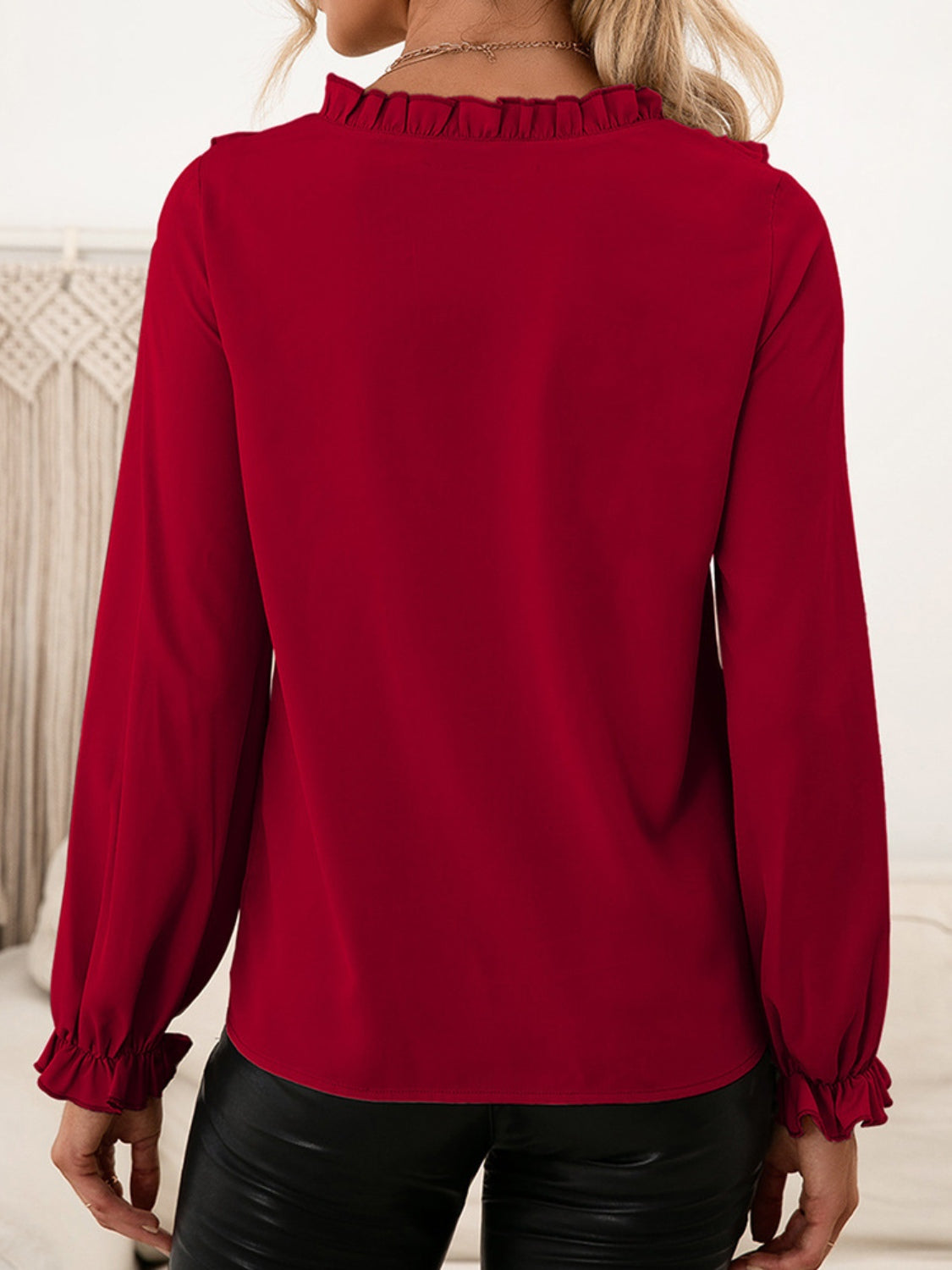 Burgundy ruffled yoke blouson sleeve top with ruffled cuffs.