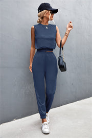 Navy cropped muscle tank and jogger set with elastic waistbands and cuffs.
