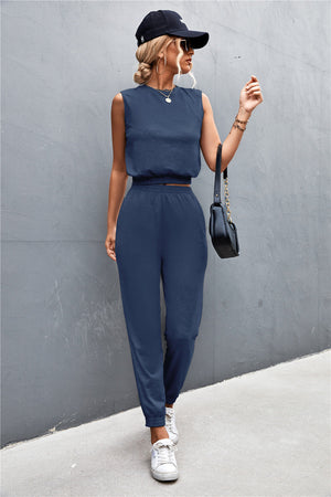 Navy cropped muscle tank and jogger set with elastic waistbands and cuffs.