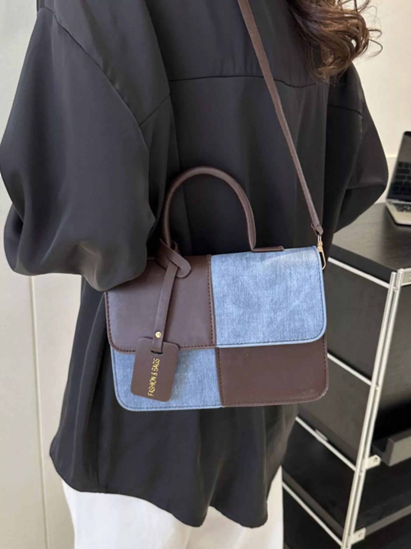 Chic two-tone PU leather crossbody bag with brown and light blue patchwork design.