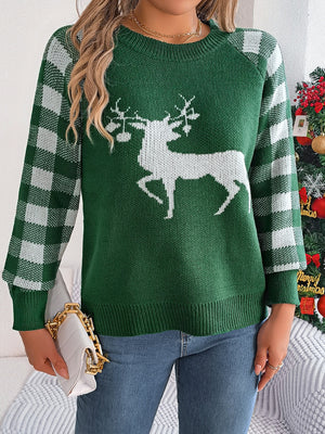 Green crewneck sweater with white reindeer graphic and plaid sleeves.