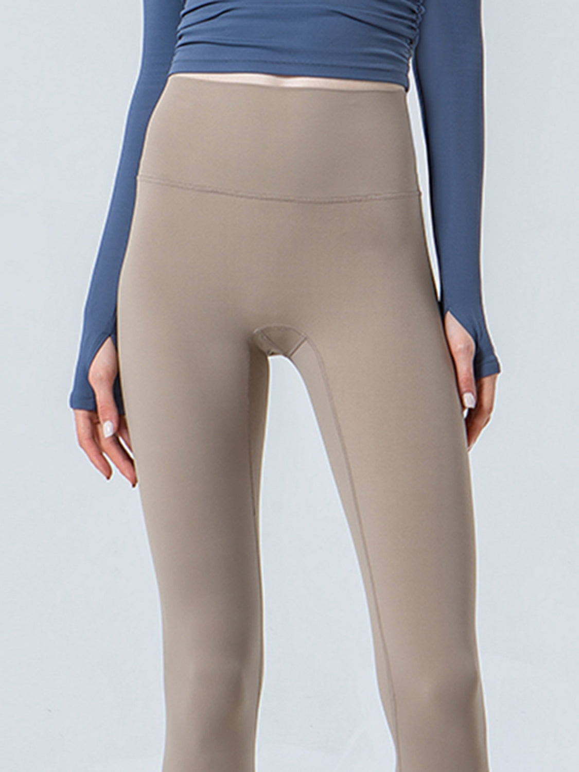 Beige sculpted crop leggings with a high waistband and subtle seam details.