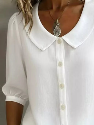 White button-down shirt with Peter Pan collar and puff sleeves.