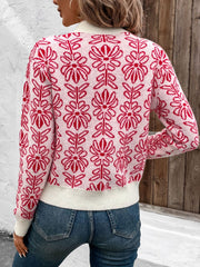 Intarsia floral crewneck knit sweater in scarlet acrylic with a white ribbed hem and cuffs.
