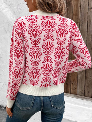 Intarsia floral crewneck knit sweater in scarlet acrylic with a white ribbed hem and cuffs.