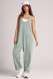 Relaxed fit matcha green tank jumpsuit with v-neck and large front pockets.