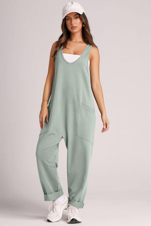 Relaxed fit matcha green tank jumpsuit with v-neck and large front pockets.