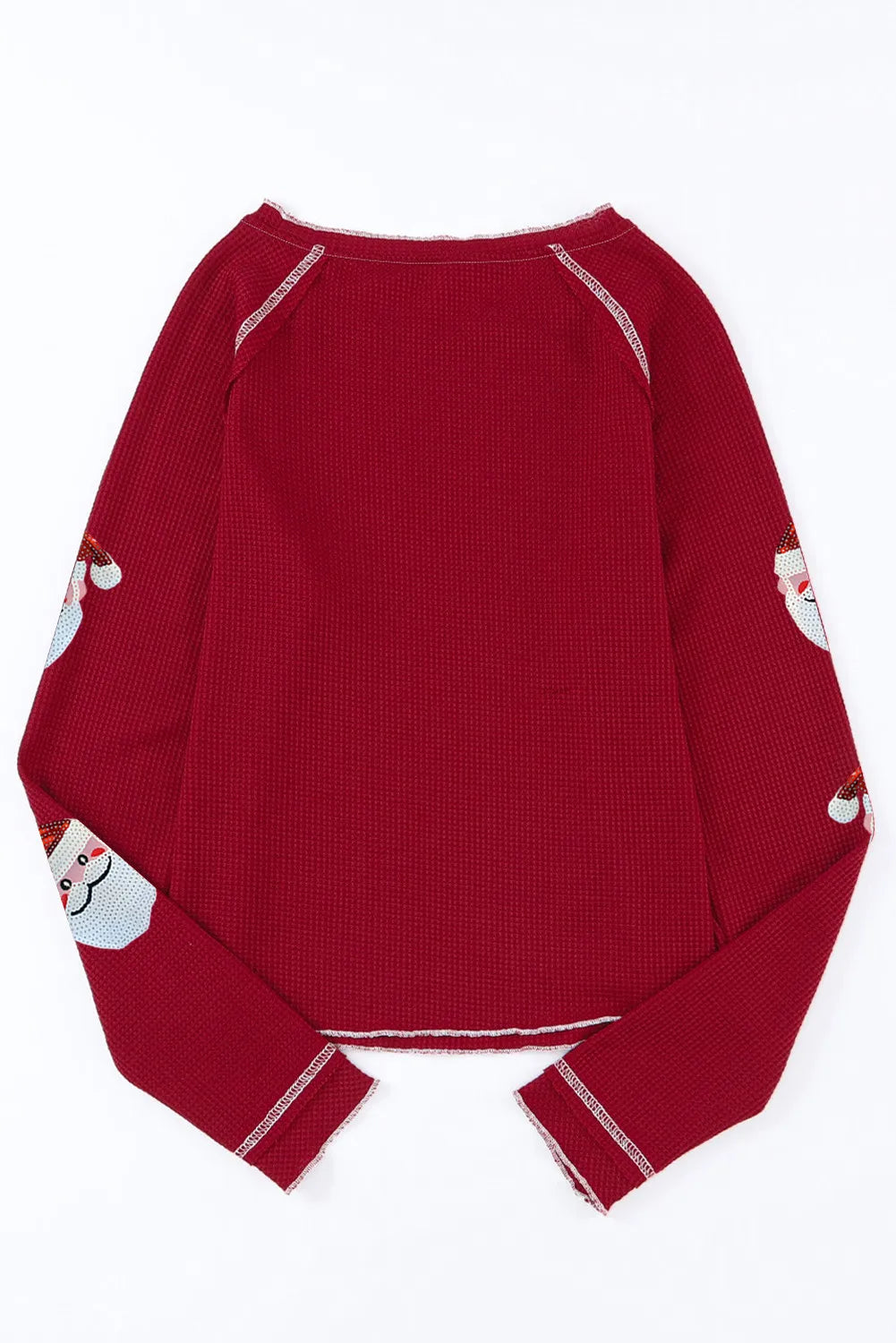 Scarlet waffle knit top with sequin Santa details on sleeves.