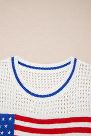 White eyelet knit sweater with American flag detail and blue striped neckline.