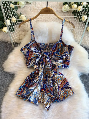 Chic cami with paisley print, smocked bodice, and tie-front detail.