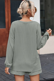 Sage ribbed knit outfit set with long sleeves and shorts, casual loungewear.