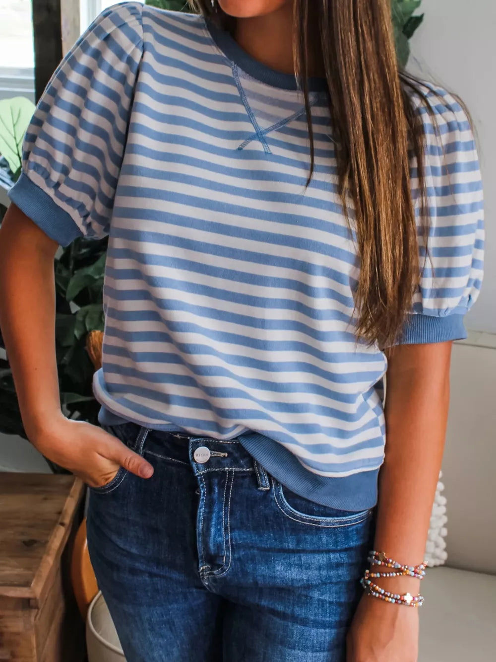Chic blue and white striped t-shirt with bubble sleeves and crew neck.