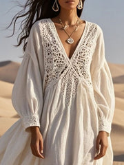White crochet lace V-neck midi dress with balloon sleeves and cutout detail.