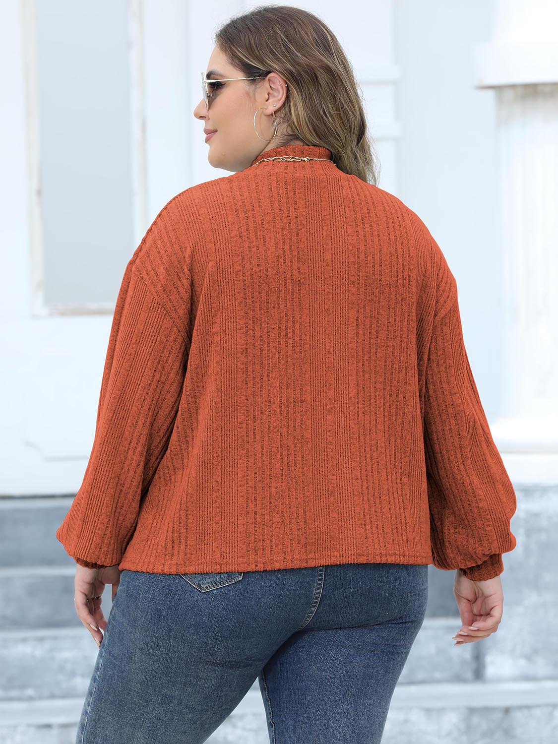 Textured mock neck sweater in Ochre with balloon sleeves.