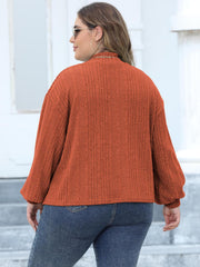 Textured mock neck sweater in Ochre with balloon sleeves.