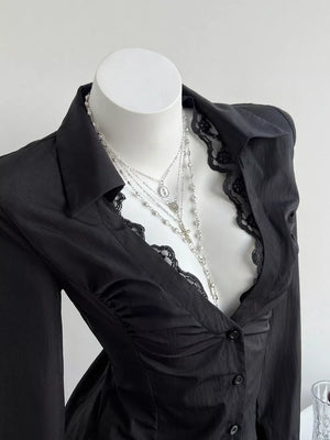 Black lace-trimmed V-neck maternity shirt with ruched detail and buttons.