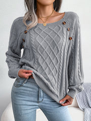 Charcoal cable-knit sweater with buttoned shoulder detail and crew neck.