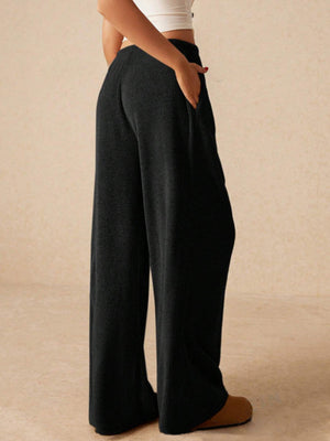 Black ribbed palazzo lounge pants with pockets, wide leg, cotton blend.