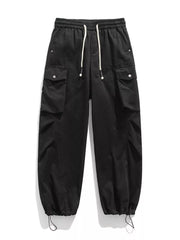 Black cargo pants with drawstring waist and hem, featuring button-flap pockets.