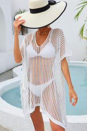 White open-knit beach cover-up with fringe detail and V-neck.
