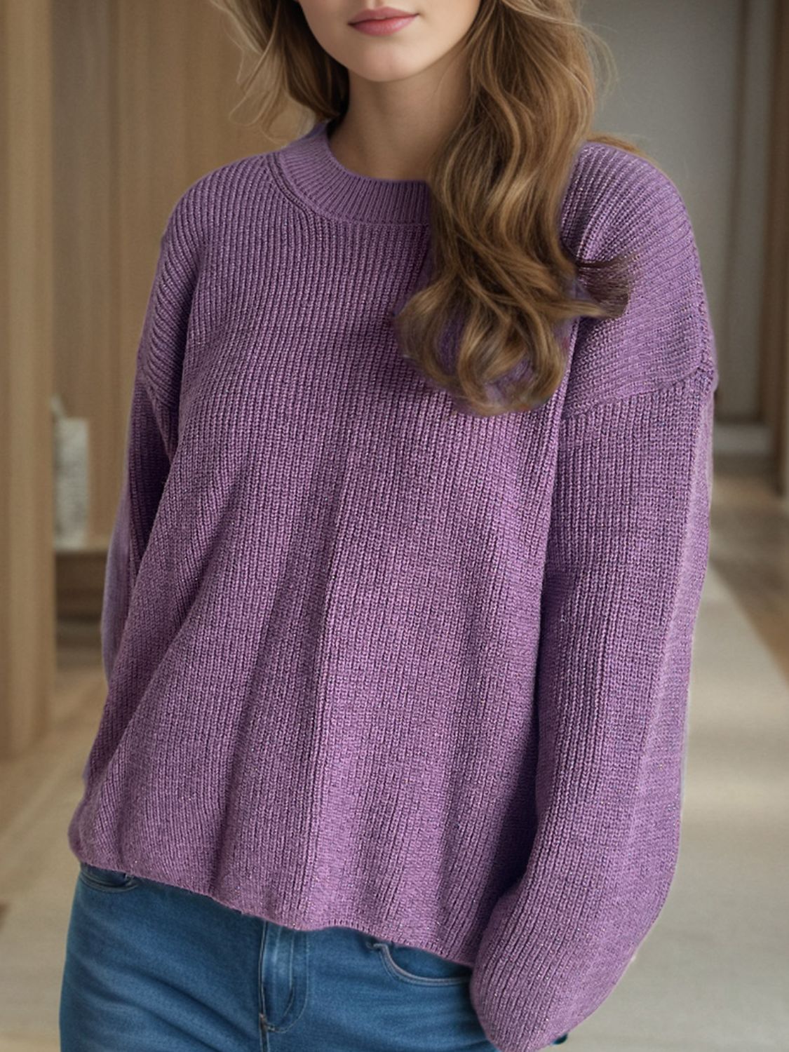 Textured ribbed knit oversized sweater in mauve with crew neck and long sleeves.