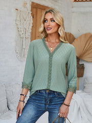 Sage eyelet trimmed V-neck blouse with lace detail on neckline and sleeves