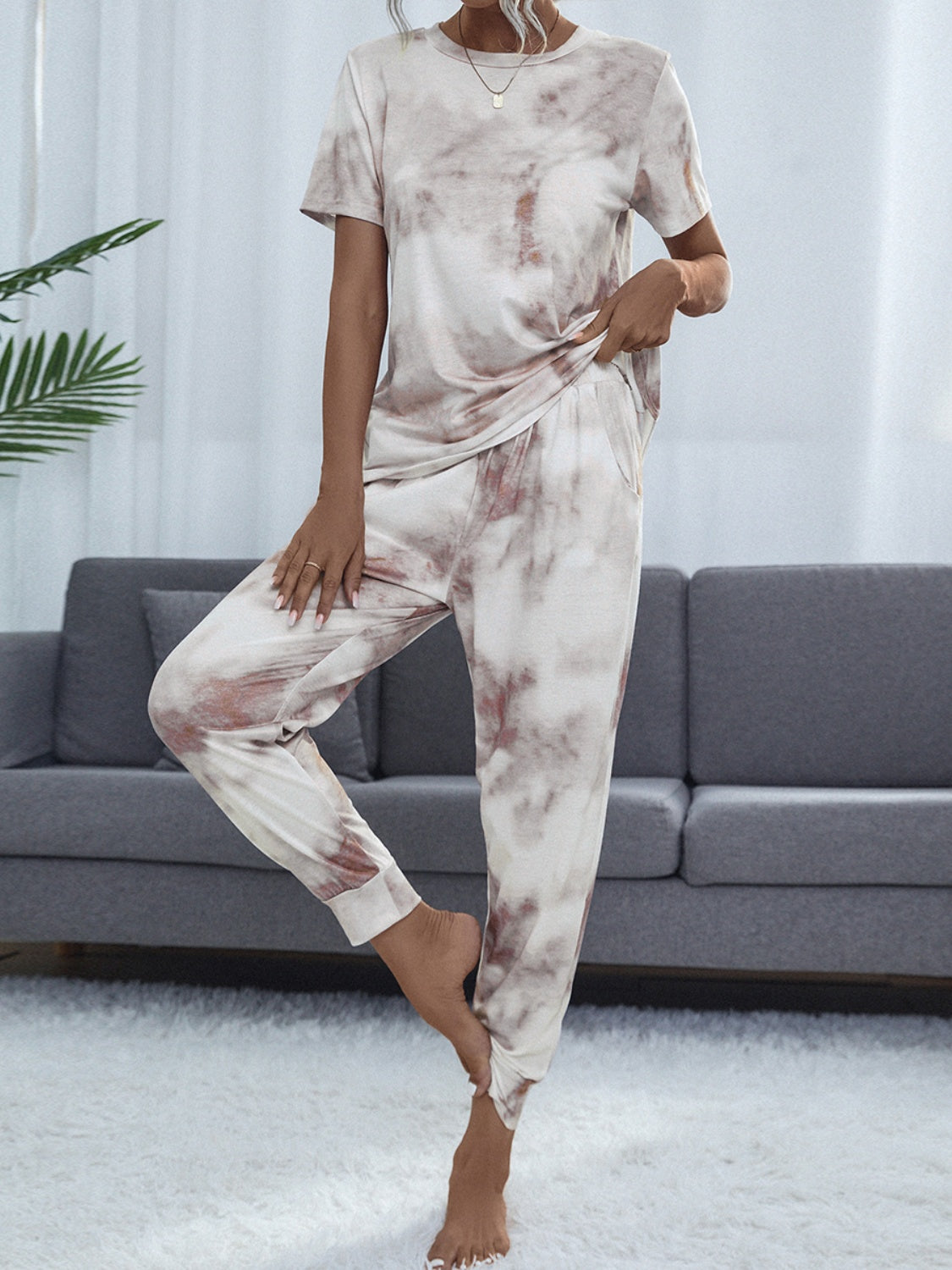 Cloudwash Lounge Set with tie-dye pattern in beige and brown, featuring a crew neck tee and jogger pants.