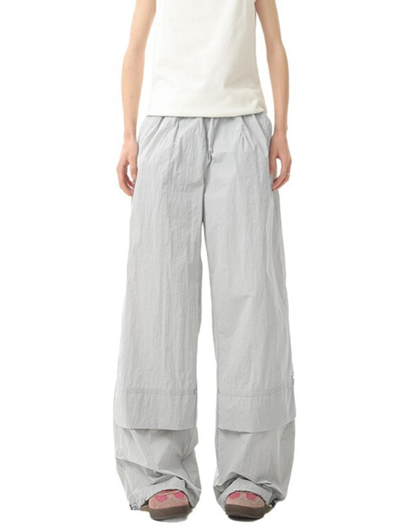 Men's light gray lightweight cargo pants with a relaxed fit and layered cuffs.