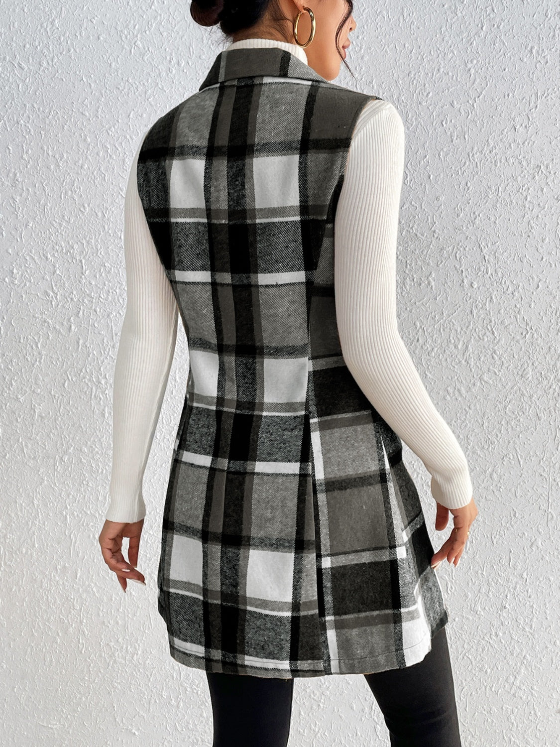 Sleeveless plaid blazer dress in black and white, with a collared neckline and A-line skirt.
