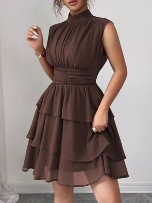 Dark Brown sleeveless ruffle tiered dress with ruched bodice and waist.