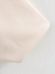 Oversized zip-up jacket in off-white with a textured knit fabric detail.