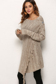 Asymmetric fringe knit cardigan in oatmeal with button detail and diagonal stripe pattern.