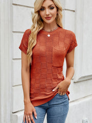 Textured knit pocket tee in rust orange with short sleeves and a crew neck.